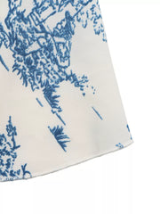 Charming Floral Tie-front Cami Top in blue with a tie-front detail.