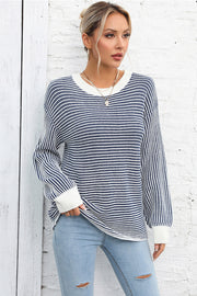 Nautical stripe ribbed knit crewneck sweater with white cuffs and neckline.