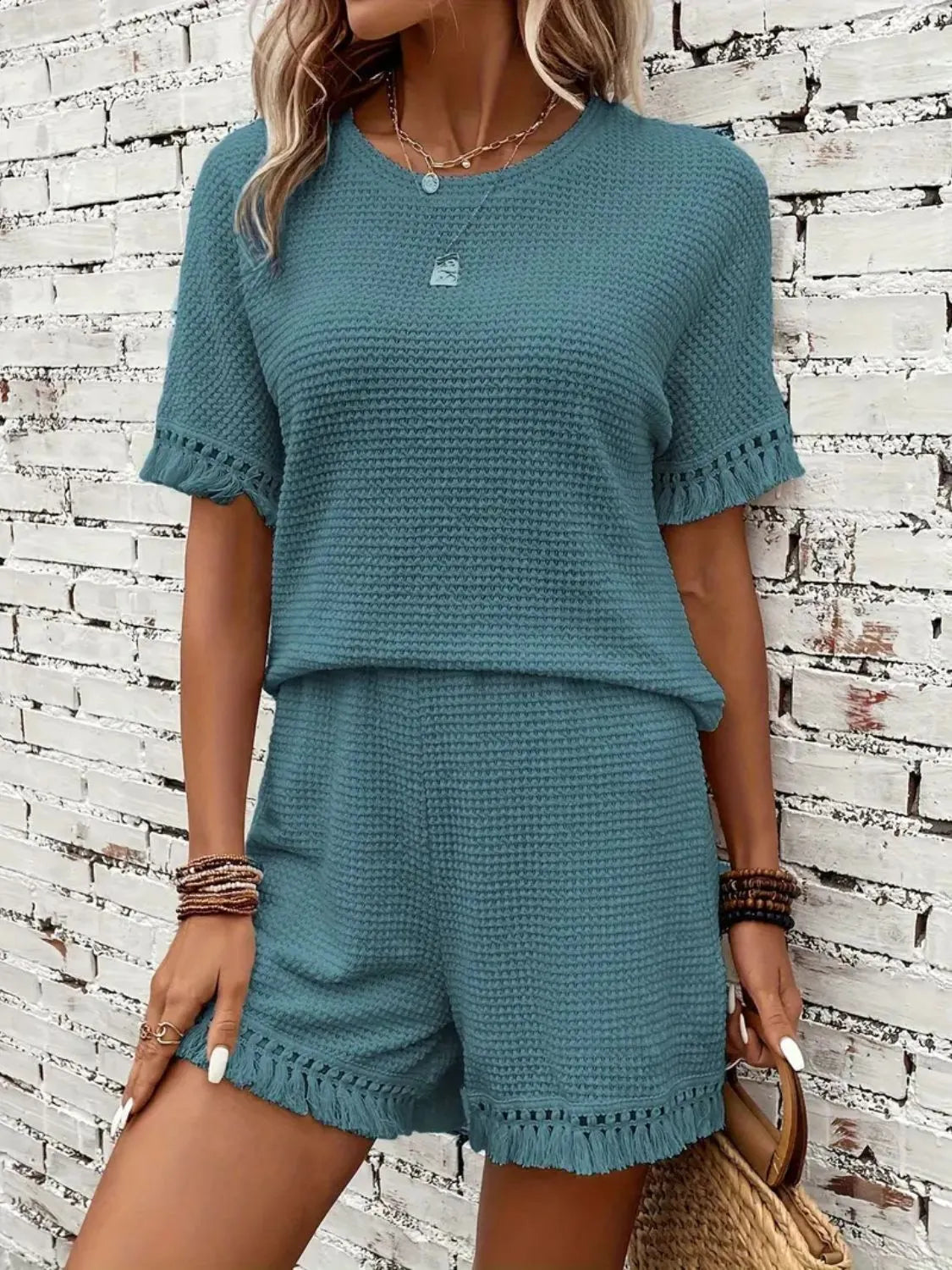 Textured knit set in Air Force Blue with fringe trim on short sleeves and hem.