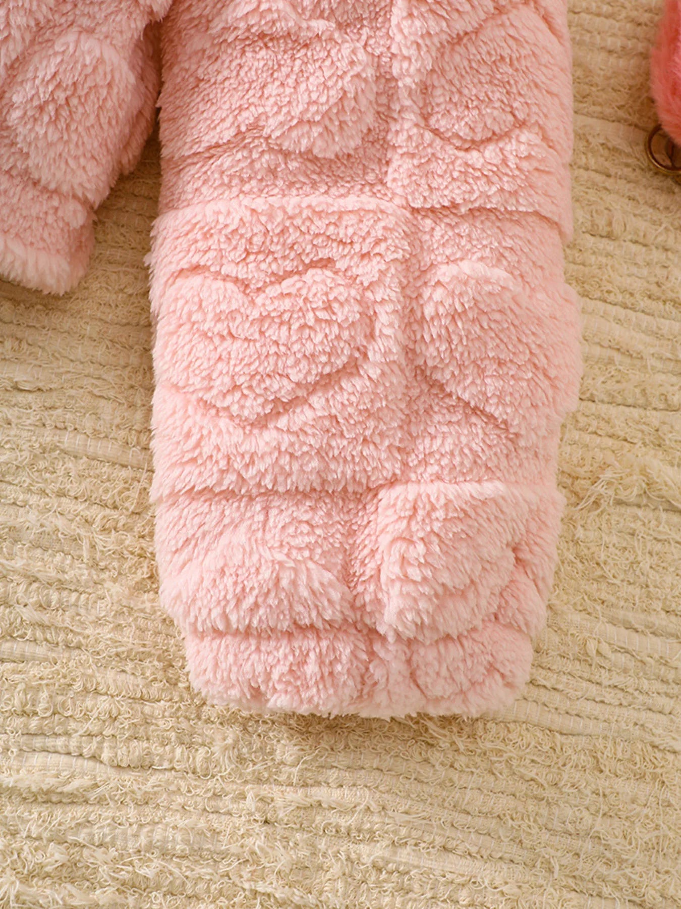 Dusty pink fuzzy jacket with heart pattern detail