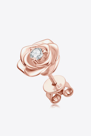 Rose gold stud earrings shaped like a rose with a diamond center.