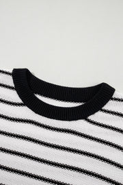 Black and cream striped knit sweater with contrast trim neckline.
