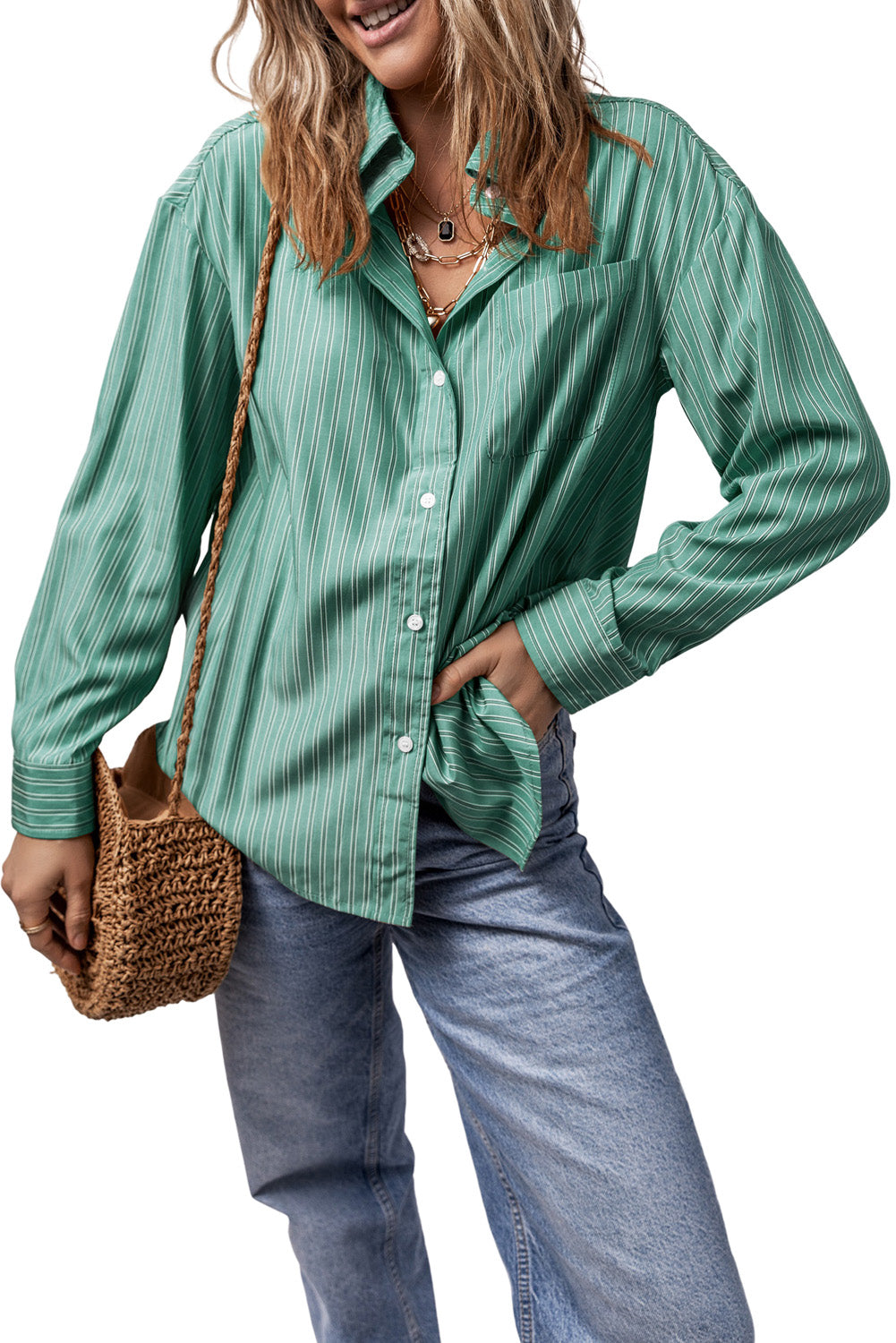 Oversized Sage stripe Oxford shirt with button front and pocket, styled with jeans.