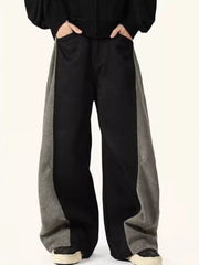 Men's black sweatpants with grey contrast panels and relaxed fit