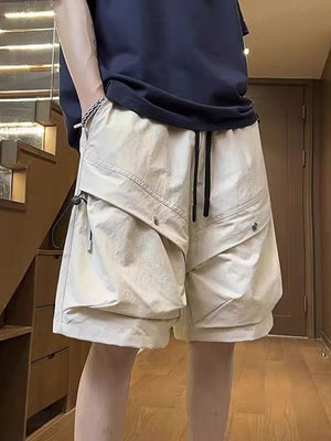 Beige lightweight cargo shorts with drawstring and multiple pockets.