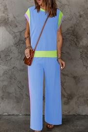Colorblock sportswear set with contrast trim in light blue, lime green, and lavender.