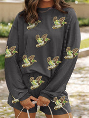 Dark gray ribbed loungewear set with allover sequin duck patches and a mock neck.
