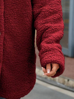 Teddy-texture shacket in wine with button detail and cuffed sleeves.