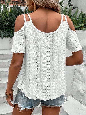 White eyelet cold shoulder blouse with scalloped hem and short sleeves.