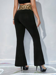 Black flare trousers with leopard print waistband