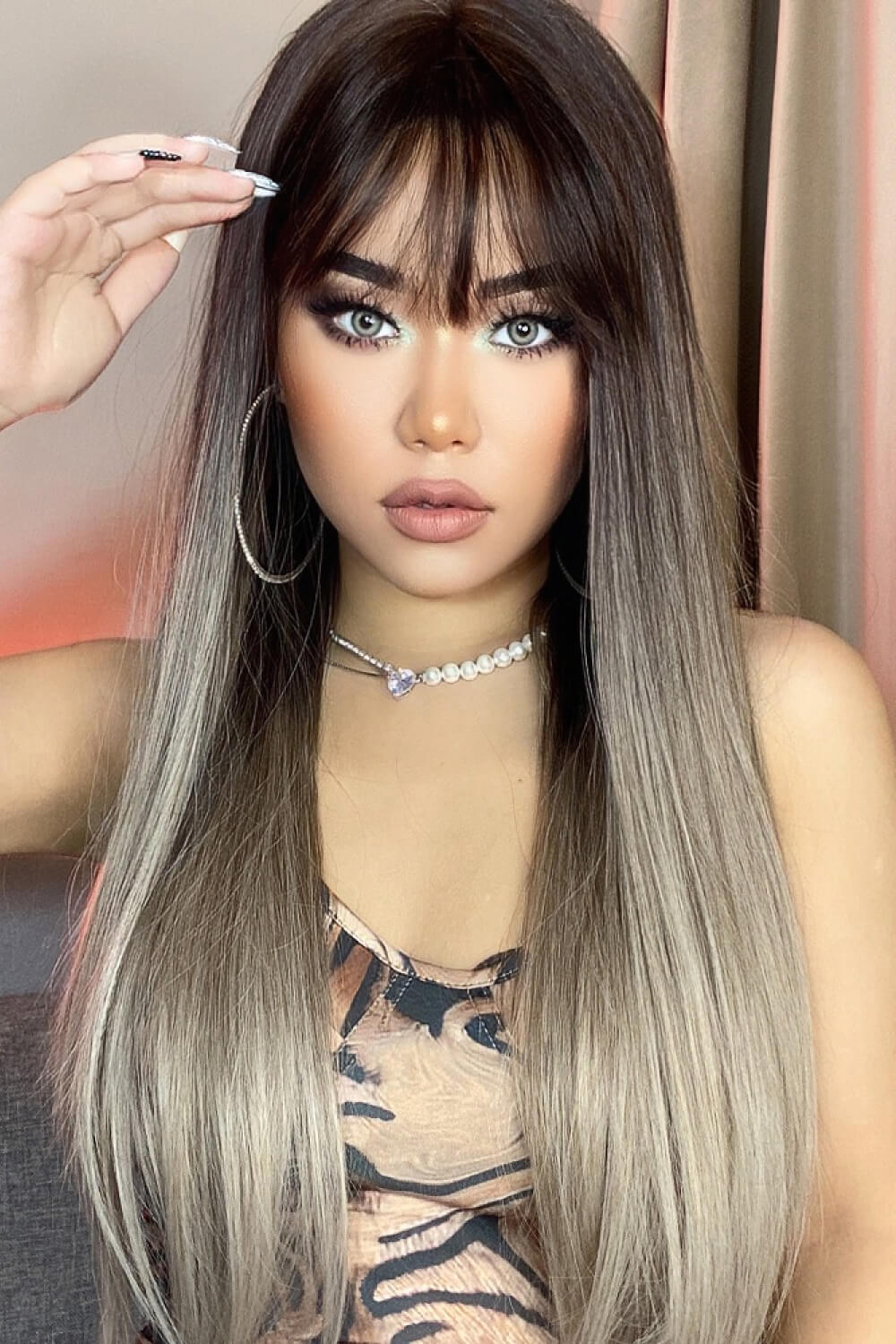 Ombre fringe synthetic hair extension in black to gray with straight strands and bangs.