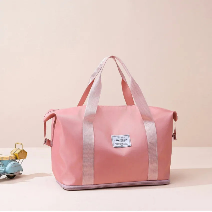 Dusty Pink nylon tote bag with dual handles and a central label.