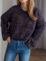 Textured knit sweater in dark blue with multicolor flecks, featuring balloon sleeves and a V-neck.