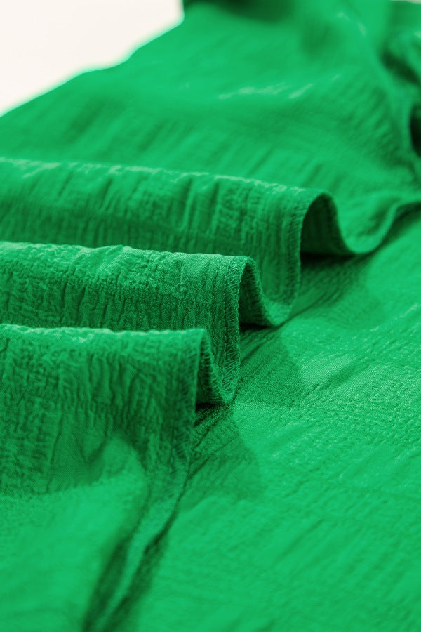 Green textured ruffle sleeve crew neck top fabric detail