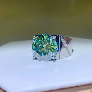 Emerald cut moissanite signet ring in silver with diamond accents on band.
