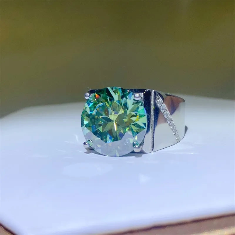 Emerald cut moissanite signet ring in silver with diamond accents on band.