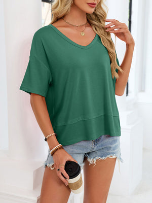 Relaxed fit dark green v-neck t-shirt with short sleeves and a layered hem detail.