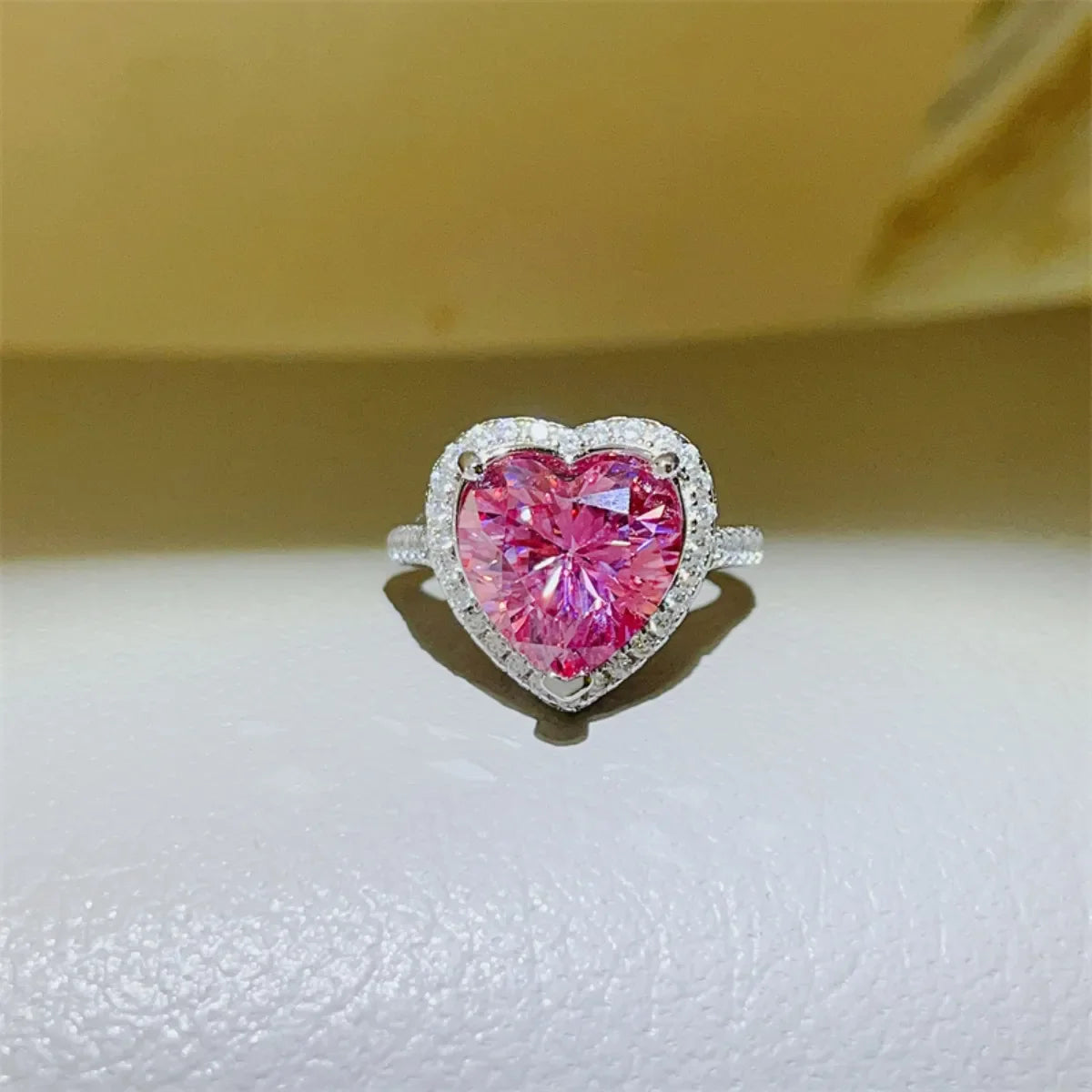 Radiant Heart Moissanite Halo Ring in Fuchsia Pink with a diamond-accented band.