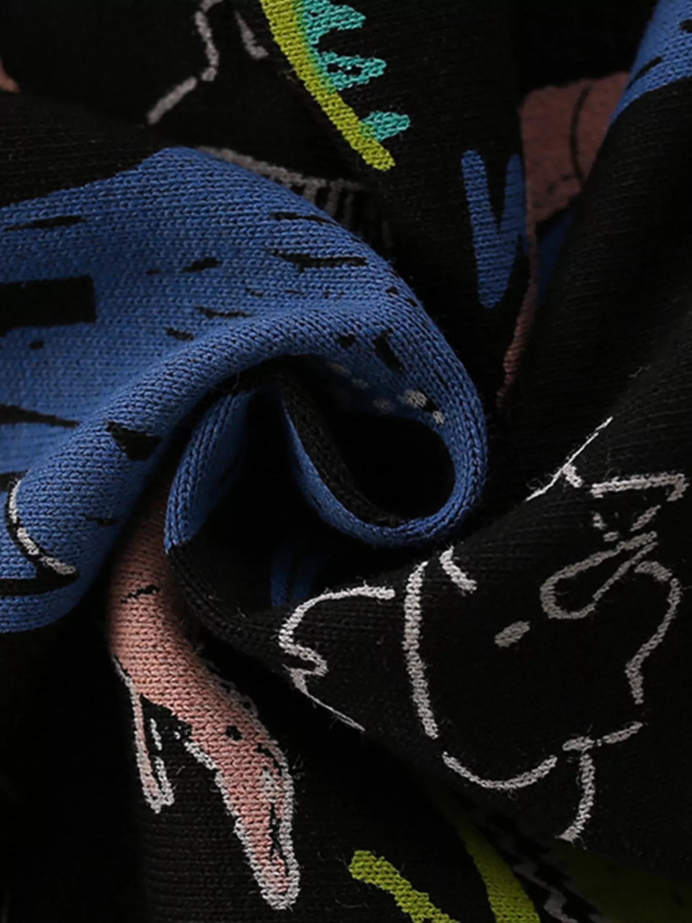 Black crew neck sweatshirt with a colorful dinosaur print and textured knit detail.