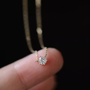 Delicate sterling silver necklace with a clear zircon pendant.