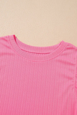 Pink ribbed knit top with ruffled sleeve detail