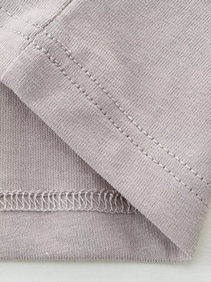Gray cotton t-shirt detail showing stitching and fabric texture.