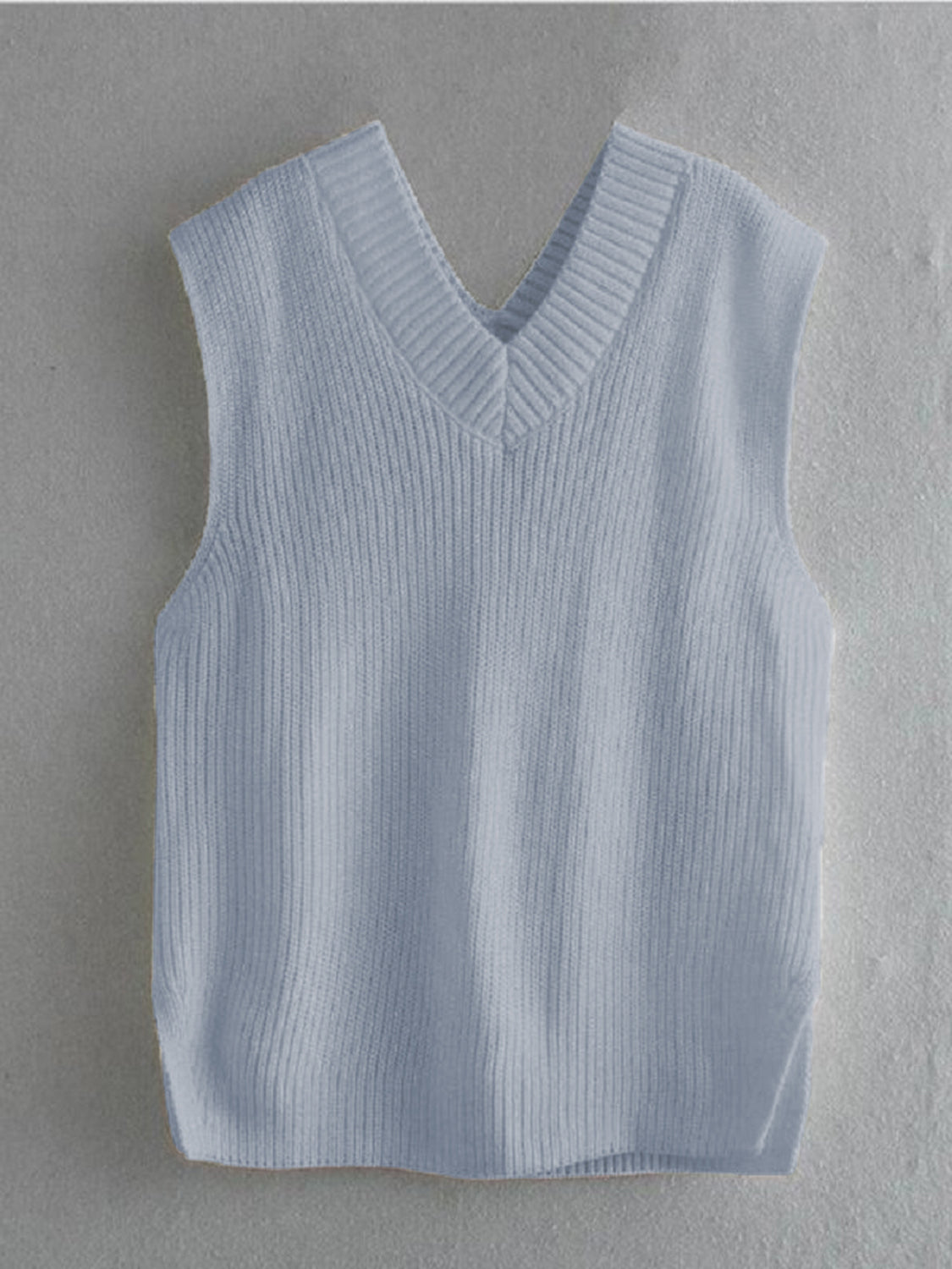 Pastel blue textured knit vest with V-neck and asymmetric hem