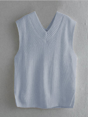 Pastel blue textured knit vest with V-neck and asymmetric hem