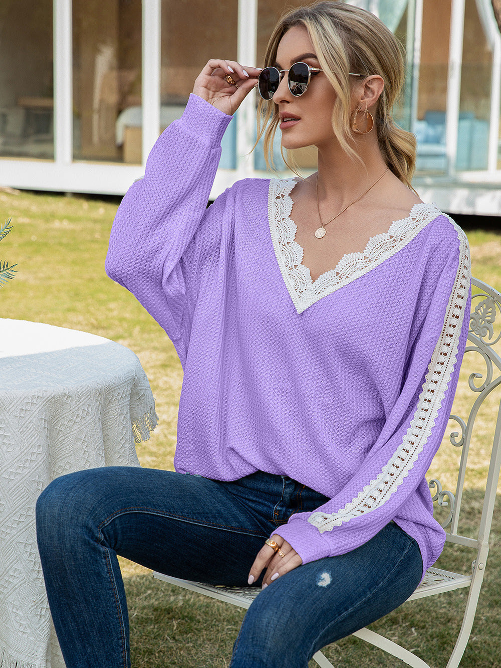 Lavender waffle knit v-neck top with white lace trim on neckline and sleeves.