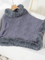 Dark Gray cable knit acrylic poncho with faux fur trim and cowl neck.