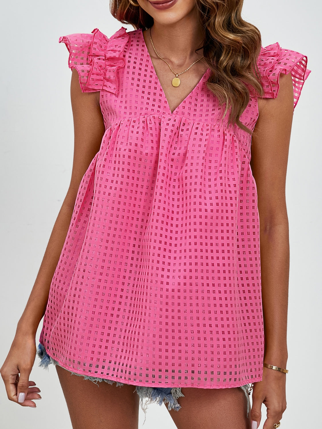 Hot Pink textured trapeze blouse with ruffle sleeves and V-neck.