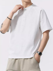 Men's white buttoned henley t-shirt with short sleeves and a crew neck.