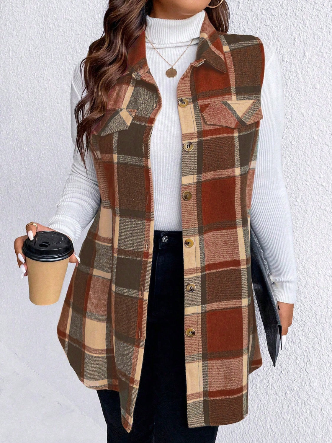 Oversized plaid shirt vest in brown, camel, and rust with button front and chest pockets.