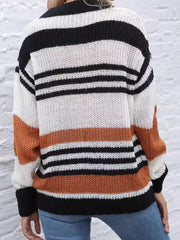 Casual striped knit sweater with color block accents in beige, black, and white acrylic.
