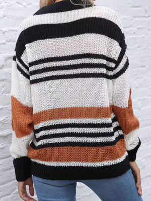 Casual striped knit sweater with color block accents in beige, black, and white acrylic.
