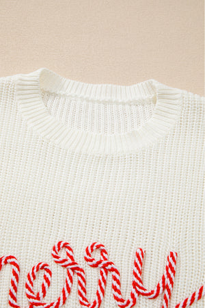 Ivory knit sweater with red and white candy cane script detail.