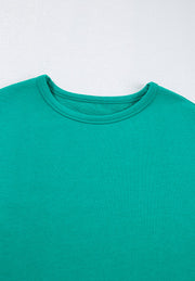 Turquoise crewneck sweatshirt with a relaxed fit and ribbed neckline detail.