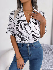 White swirl print camp collar blouse with short sleeves and button front.
