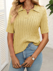Turmeric cable knit polo sweater with collar and short sleeves.