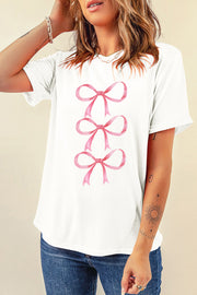 White t-shirt with three pink watercolor bows stacked vertically on the front.