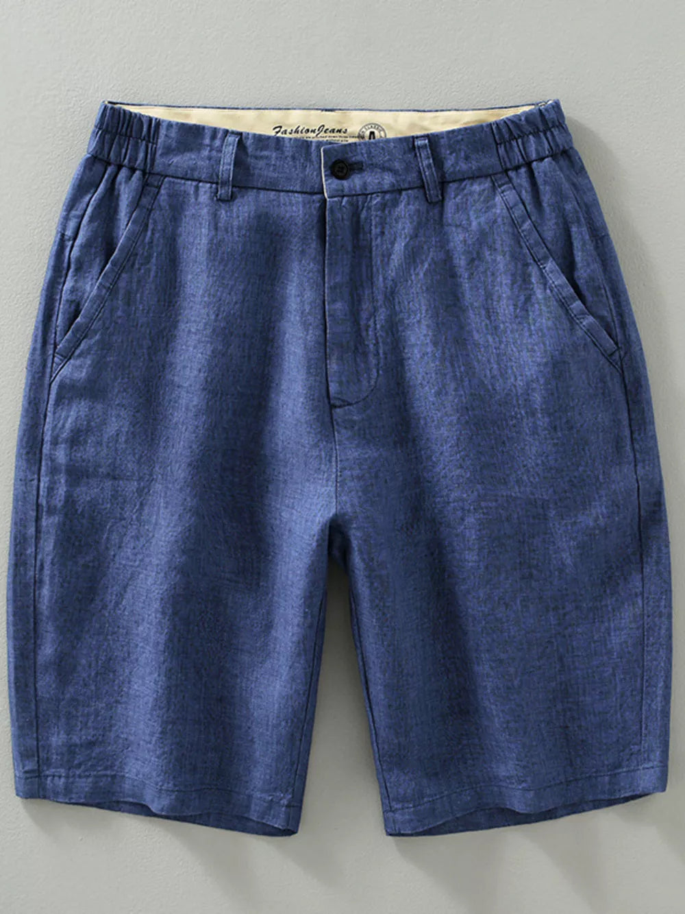 Blue chino shorts with elastic waistband and front pockets.