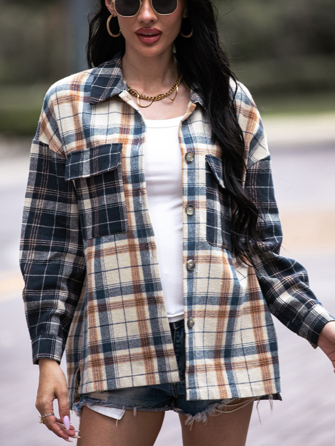 Colorblock plaid utility shacket with button front and chest pockets.