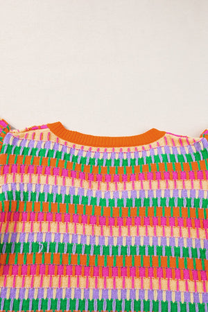 Geometric knit top with flutter sleeves in orange and green colorway.
