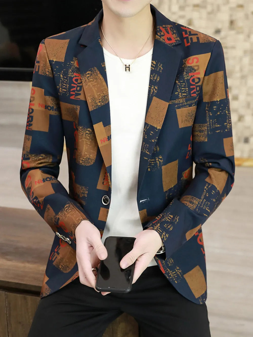 Men's slim fit blazer in navy with abstract print, buttoned front, and notched lapels.