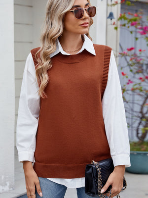 Brown ribbed knit vest with crewneck and side buttons, styled over a white shirt.