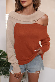 Asymmetric shoulder sweater in orange and beige acrylic with boat neck.