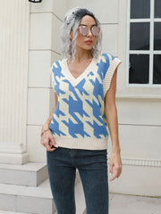 Houndstooth knit v-neck pullover vest in Azure and cream acrylic, sleeveless.