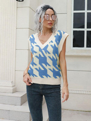 Houndstooth knit v-neck pullover vest in Azure and cream acrylic, sleeveless.