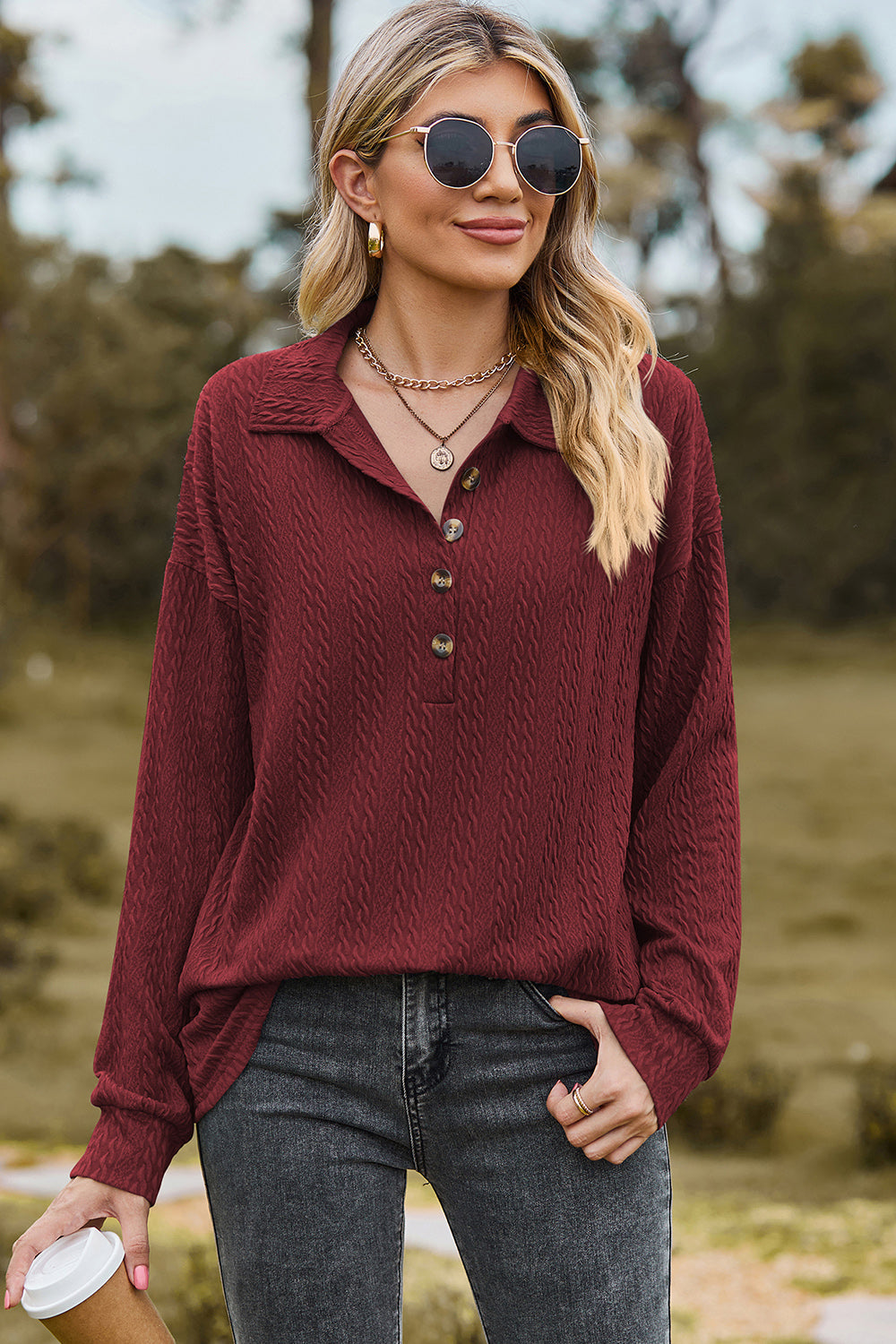 Burgundy textured polo-neck sweater with button detail and long sleeves.