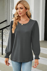 Dark gray ribbed cuff top with puff sleeves and crew neck.